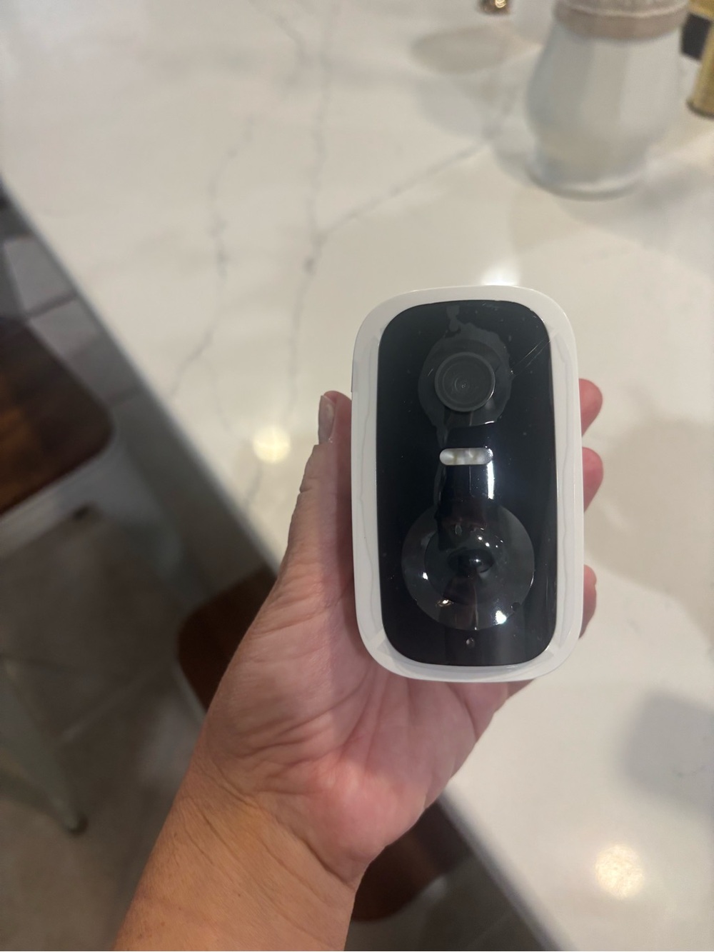 Compact White and Black Home Security Camera
